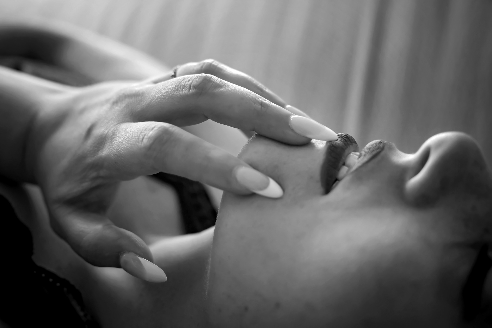 closeup of a women's face with her hands near her mouth naperville nail spa