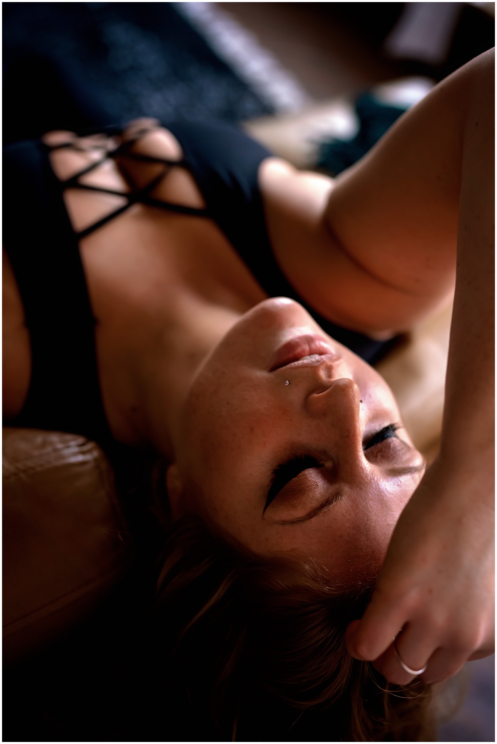 Details of a woman in black lingerie running a hand through her hair after visiting chicago hair salons